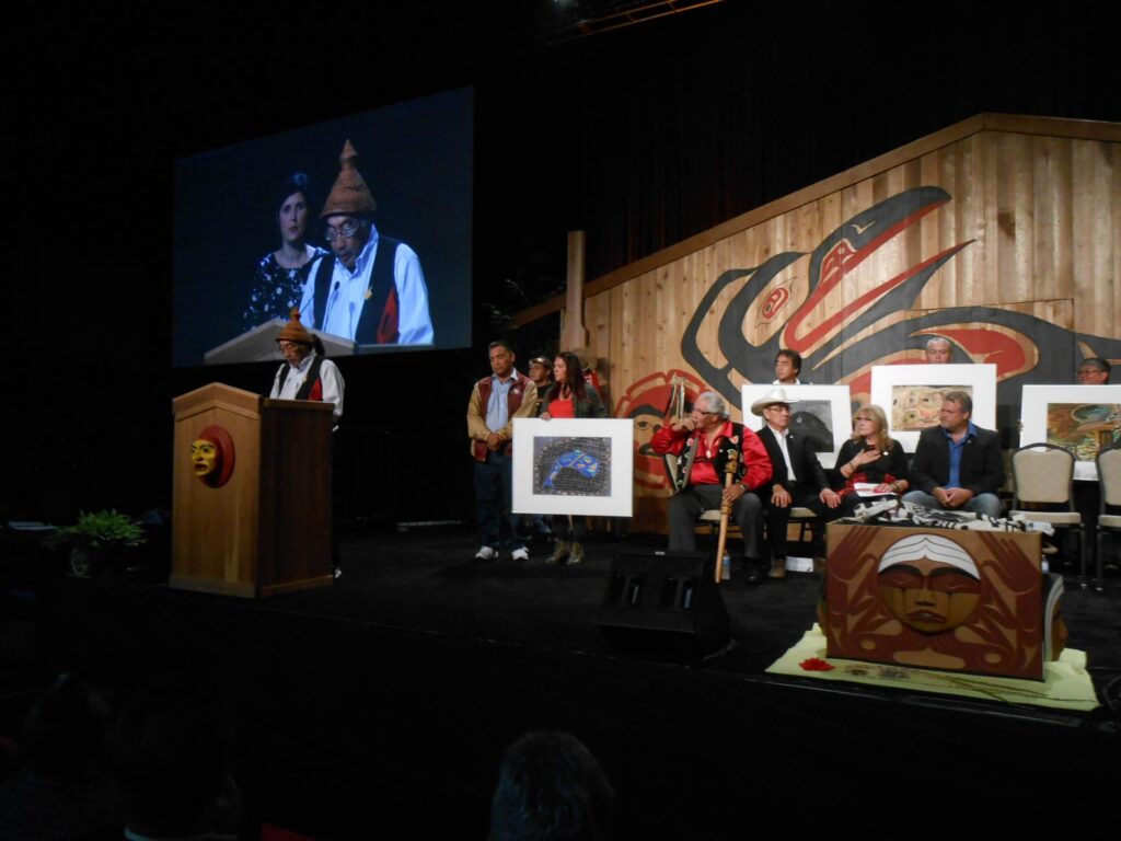 A crowd of Residential School survivors at a repatriation ceremony.