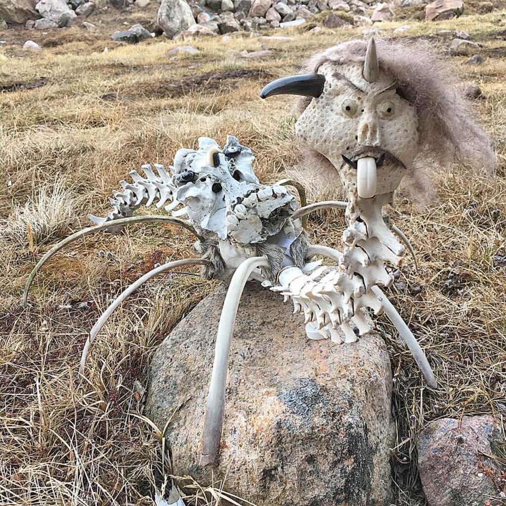 An assemblage fashioned from animal bones, hair, and other organic materials native to Nunavut