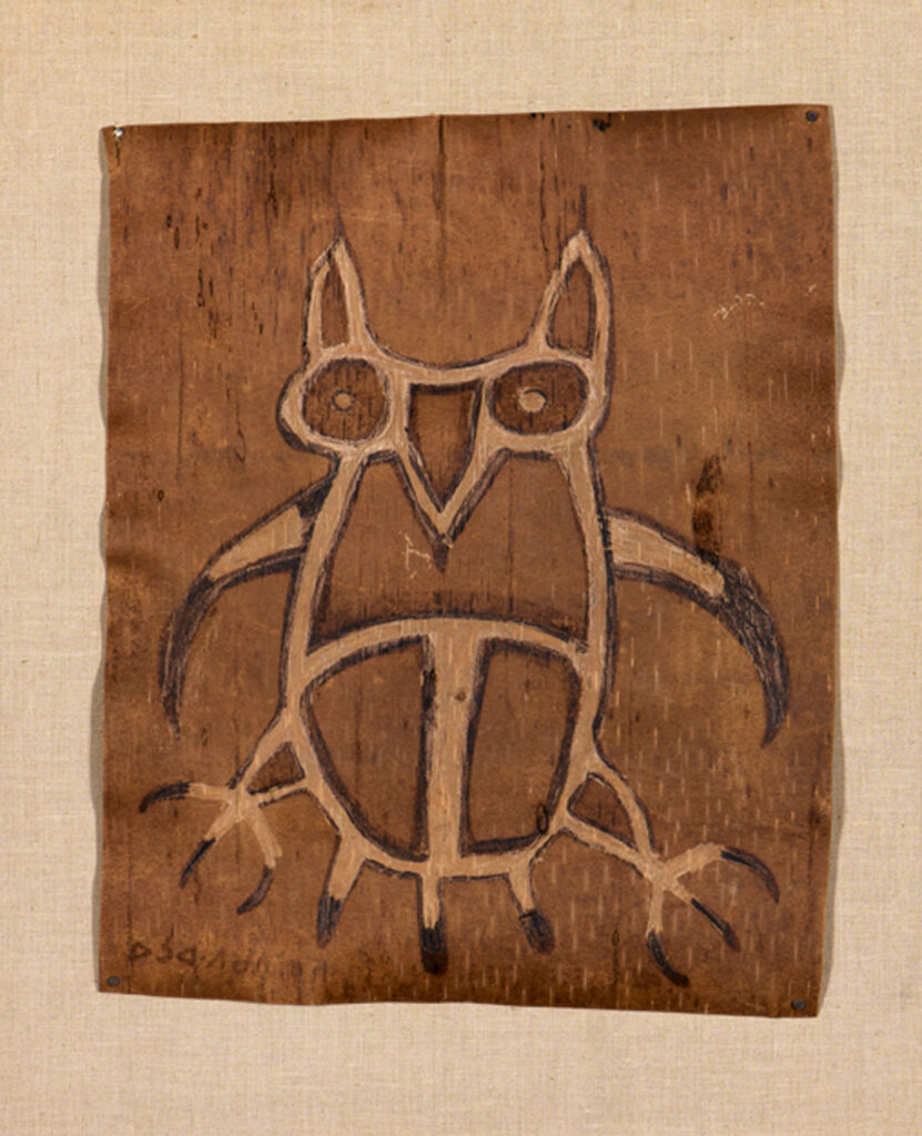 simply drawing of an owl on birch