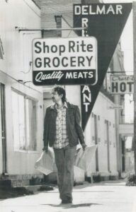 Black and white photo Norval Morrisseau at Beardmore grocery store.